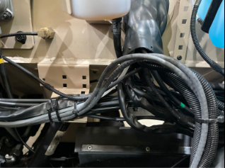 Electrical harness below clutch reservoir.PNG